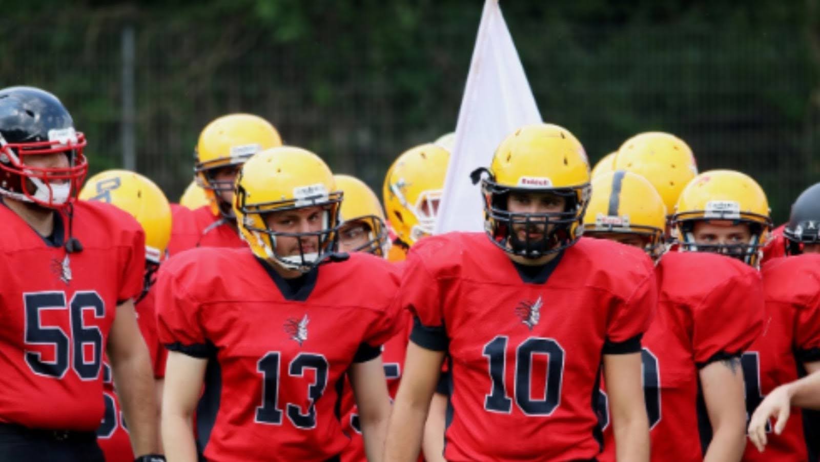 football players wearing red jerseys