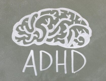 An illustration of a brain with the word ADHD written underneath, representing the topic of ADHD in adults.