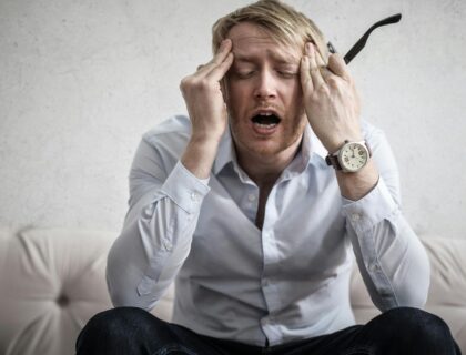 a stressed man showing the signs of risky stress relief patterns